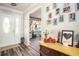 A light-filled foyer boasts hard surface floors and a decorative table arrangement at 2690 Manassas Pl, Snellville, GA 30039