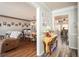 A cozy hallway featuring hard surface floors and access to the dining room and living room at 2690 Manassas Pl, Snellville, GA 30039