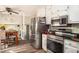 A kitchen with stainless steel appliances and lots of white cabinet storage space at 2690 Manassas Pl, Snellville, GA 30039