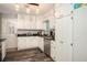 Kitchen featuring white cabinets, granite counters, stainless appliances, and exterior access at 2690 Manassas Pl, Snellville, GA 30039