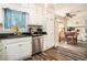 Traditional kitchen featuring white cabinets, granite counters, and stainless steel appliances at 2690 Manassas Pl, Snellville, GA 30039