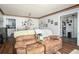 A comfortable living room and dining area combination with neutral walls and wood floors at 2690 Manassas Pl, Snellville, GA 30039