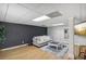 Finished basement with modern accent wall and plank flooring at 3231 Boulder Brook Dr, Lithonia, GA 30038