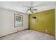 A serene bedroom featuring new carpet, a ceiling fan, and natural light from the window at 3231 Boulder Brook Dr, Lithonia, GA 30038