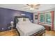 This bedroom showcases ample natural light, hardwood floors, and contemporary accents at 3231 Boulder Brook Dr, Lithonia, GA 30038