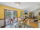 Dining area adjacent to the kitchen with a sliding door to the deck at 3231 Boulder Brook Dr, Lithonia, GA 30038