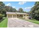 Well-maintained home featuring a long driveway and a two-car garage at 3231 Boulder Brook Dr, Lithonia, GA 30038