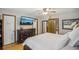 Large primary bedroom with hardwood floors, ensuite access, and a well-organized closet system at 3231 Boulder Brook Dr, Lithonia, GA 30038
