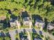 Aerial view of home shows mature landscaping and spacious driveways at 4070 Preserve Crossing Ln, Cumming, GA 30040