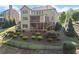 Spacious backyard with lush landscaping, fence, multilevel deck, and patio perfect for outdoor living at 4070 Preserve Crossing Ln, Cumming, GA 30040