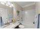 Clean bathroom with a shower/tub, granite countertop sink, and tiled walls at 4070 Preserve Crossing Ln, Cumming, GA 30040
