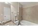 Bright bathroom featuring a granite countertop, bathtub, shower, and decorative towels at 4070 Preserve Crossing Ln, Cumming, GA 30040