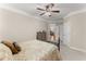 Comfortable bedroom with carpeted floors, a ceiling fan, and natural light at 4070 Preserve Crossing Ln, Cumming, GA 30040