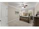 Cozy bedroom with carpeted floors, a ceiling fan, and natural light at 4070 Preserve Crossing Ln, Cumming, GA 30040