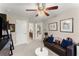 Cozy bonus room featuring a couch and decor, with a view into the bathroom and hallway at 4070 Preserve Crossing Ln, Cumming, GA 30040