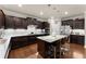 Well-equipped kitchen featuring a large island, stainless steel appliances, and ample storage space at 4070 Preserve Crossing Ln, Cumming, GA 30040