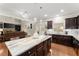 Spacious kitchen with an island, stainless steel appliances, and an open view to the living room at 4070 Preserve Crossing Ln, Cumming, GA 30040