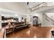 Open-concept living room with hardwood floors, a view to the kitchen, and a cozy atmosphere at 4070 Preserve Crossing Ln, Cumming, GA 30040