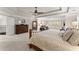 Comfortable and spacious main bedroom with large bed and staircase access at 4070 Preserve Crossing Ln, Cumming, GA 30040