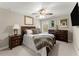 Warm and inviting main bedroom with a ceiling fan, large windows, and ensuite bathroom at 4070 Preserve Crossing Ln, Cumming, GA 30040