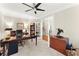 Home office featuring French doors, built-in bookcase, and traditional desk at 4070 Preserve Crossing Ln, Cumming, GA 30040