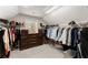 Walk-in closet offering lots of storage, including shelving, drawers, and hanging racks at 4070 Preserve Crossing Ln, Cumming, GA 30040