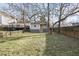 Spacious backyard featuring a lawn, mature trees, and a partial fence at 1084 Kirkwood Se Ave, Atlanta, GA 30316