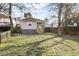 Wide backyard with a partial fence, a lawn, and some shade trees at 1084 Kirkwood Se Ave, Atlanta, GA 30316