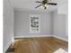 Cozy bedroom with hardwood floors and natural light from the window at 1084 Kirkwood Se Ave, Atlanta, GA 30316