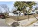Exterior view of home with gray siding, a fenced yard, and a sidewalk on a sunny day at 1084 Kirkwood Se Ave, Atlanta, GA 30316