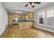 Open kitchen with wooden cabinets, stainless steel appliances, and natural light from a large window at 1084 Kirkwood Se Ave, Atlanta, GA 30316