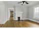 Bright living room with hardwood floors, a decorative fireplace, and neutral paint creating a cozy atmosphere at 1084 Kirkwood Se Ave, Atlanta, GA 30316