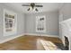 Elegant living room featuring hardwood floors, large windows, and a fireplace with mantel at 1084 Kirkwood Se Ave, Atlanta, GA 30316