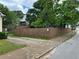 View of a fenced side yard with street parking at 1084 Kirkwood Se Ave, Atlanta, GA 30316
