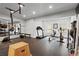 Well-equipped home gym with mirrored walls, fitness equipment, and ample workout space at 120 Nezhat Pl, Atlanta, GA 30350