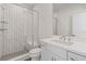 Modern bathroom featuring a glass-enclosed shower with subway tile and a sleek vanity with white countertops at 481 Hammons Way, Atlanta, GA 30315