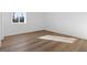 Cozy bedroom with wood floors and a sunny window at 481 Hammons Way, Atlanta, GA 30315