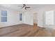 Bright, modern bedroom with wood floors, and a ceiling fan at 481 Hammons Way, Atlanta, GA 30315