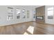 A bright and airy living room featuring many windows, hardwood floors and a fireplace at 481 Hammons Way, Atlanta, GA 30315