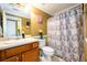 Bathroom featuring a single vanity, toilet, and shower/tub combo with shower curtain at 260 Shadowbrooke Dr, Loganville, GA 30052