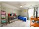 Bedroom with a crib and toddler bed, ceiling fan, and neutral carpet at 260 Shadowbrooke Dr, Loganville, GA 30052
