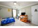 Bedroom featuring a toddler bed, ceiling fan, and neutral carpet at 260 Shadowbrooke Dr, Loganville, GA 30052