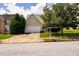 Charming home with an attached garage, lush landscaping, and a welcoming front yard at 260 Shadowbrooke Dr, Loganville, GA 30052