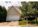 Single-Gathering home with a manicured lawn and a two-car garage in a suburban setting at 260 Shadowbrooke Dr, Loganville, GA 30052