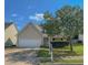Charming single-Gathering home featuring a two-car garage and well-manicured front yard at 260 Shadowbrooke Dr, Loganville, GA 30052