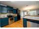 This kitchen features stainless steel appliances, granite countertops, and custom cabinets at 260 Shadowbrooke Dr, Loganville, GA 30052
