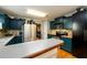 This kitchen features stainless steel appliances, ample countertop space, and custom cabinets at 260 Shadowbrooke Dr, Loganville, GA 30052