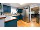 Features a stainless steel refrigerator, granite countertops, and beautiful custom cabinets at 260 Shadowbrooke Dr, Loganville, GA 30052