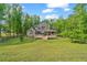Lovely backyard with a large deck and mature trees at 351 Allendale Dr, Canton, GA 30115
