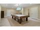 Finished basement with a pool table and bright, modern light fixture at 351 Allendale Dr, Canton, GA 30115